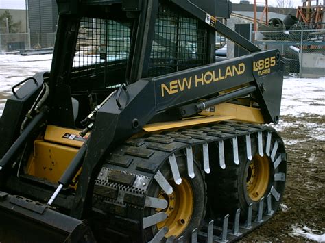 tracked skid steer on concrete|tracks on a tractor steer.